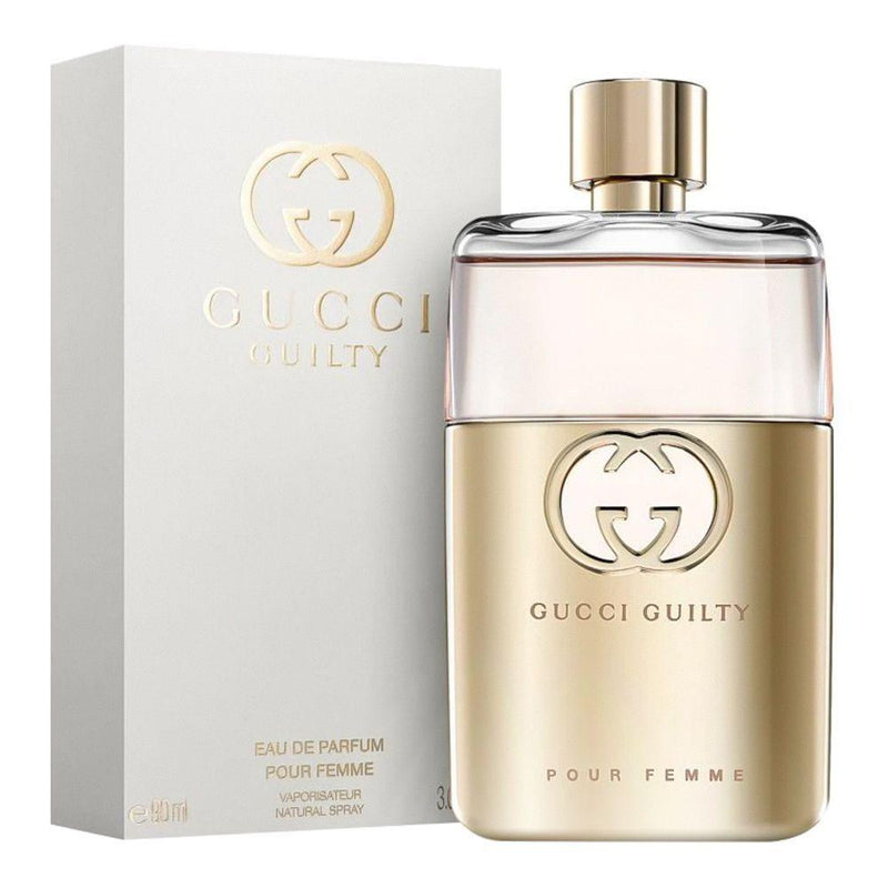 Gucci Guilty perfume bottle and packaging on a white background